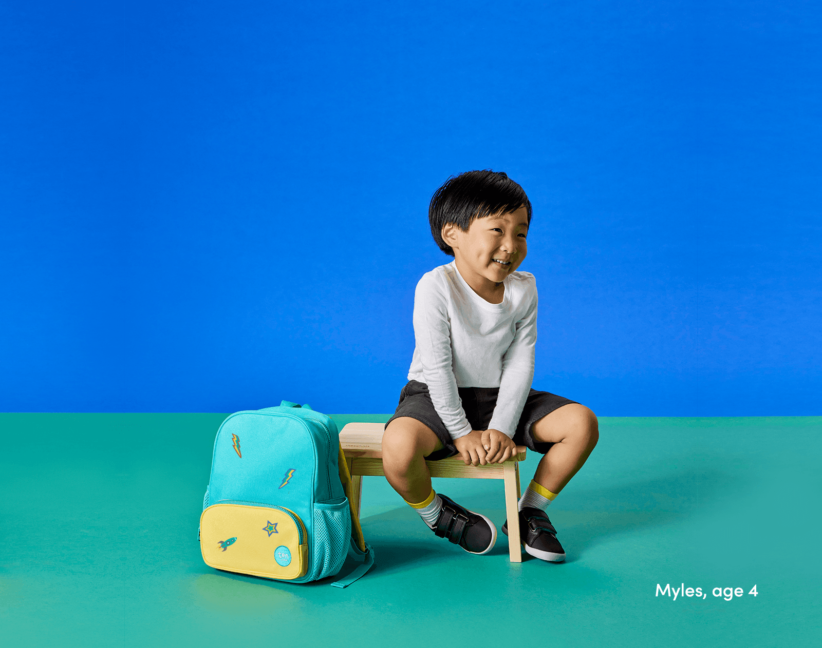 Child using backpack and shoes with Ten Little Jumbo Stickers - Available at www.tenlittle.com