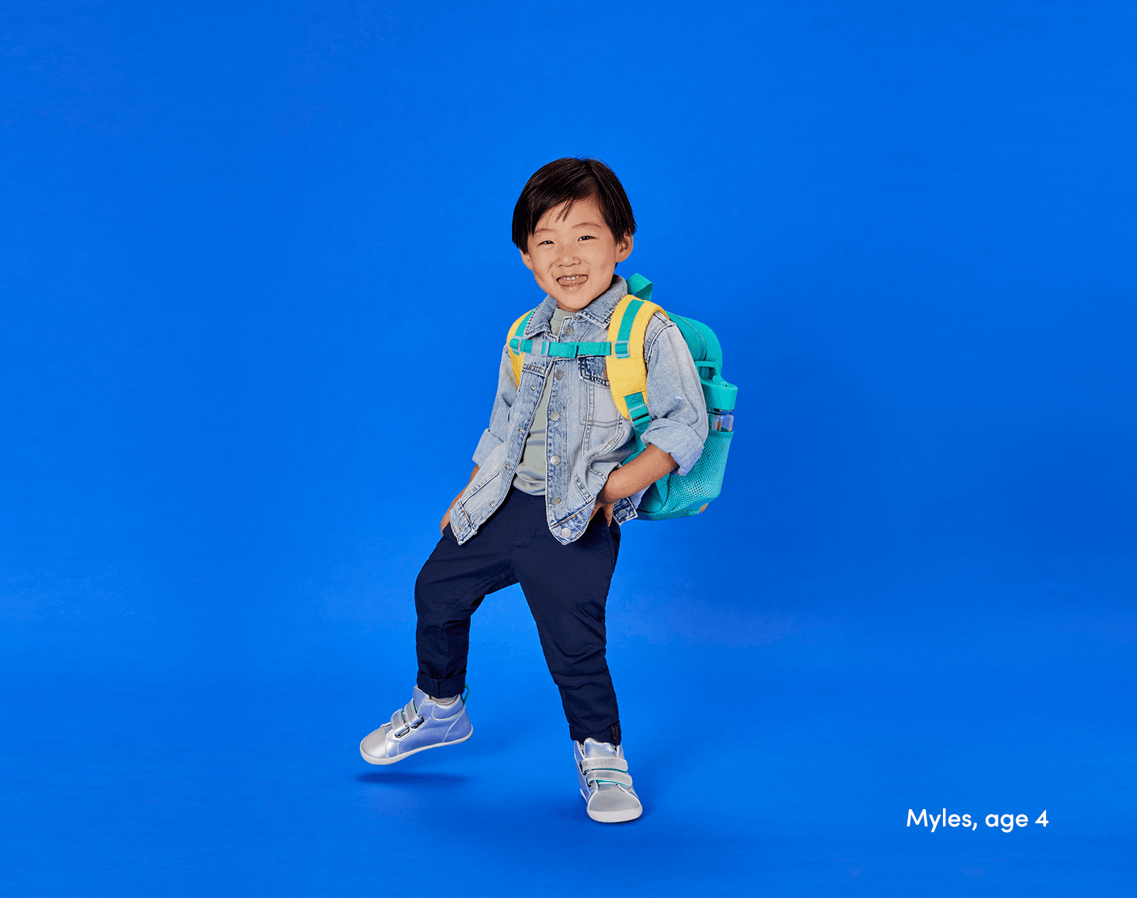 Boy age 4 wearing Ten Little Recycled Backpack 12 Inch - Teal & Yellow. Available at www.tenlittle.com