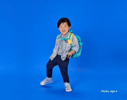 Boy age 4 wearing Ten Little Recycled Backpack 12 Inch - Teal & Yellow. Available at www.tenlittle.com