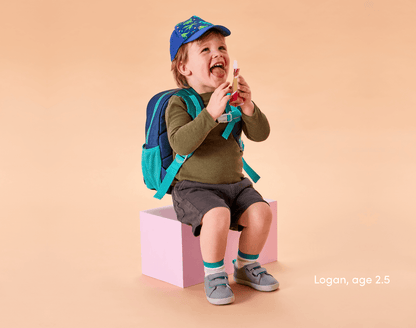 Boy age 2.5 wearing Ten Little Recycled Backpack 12 Inch - Navy & Green. Available at www.tenlittle.com