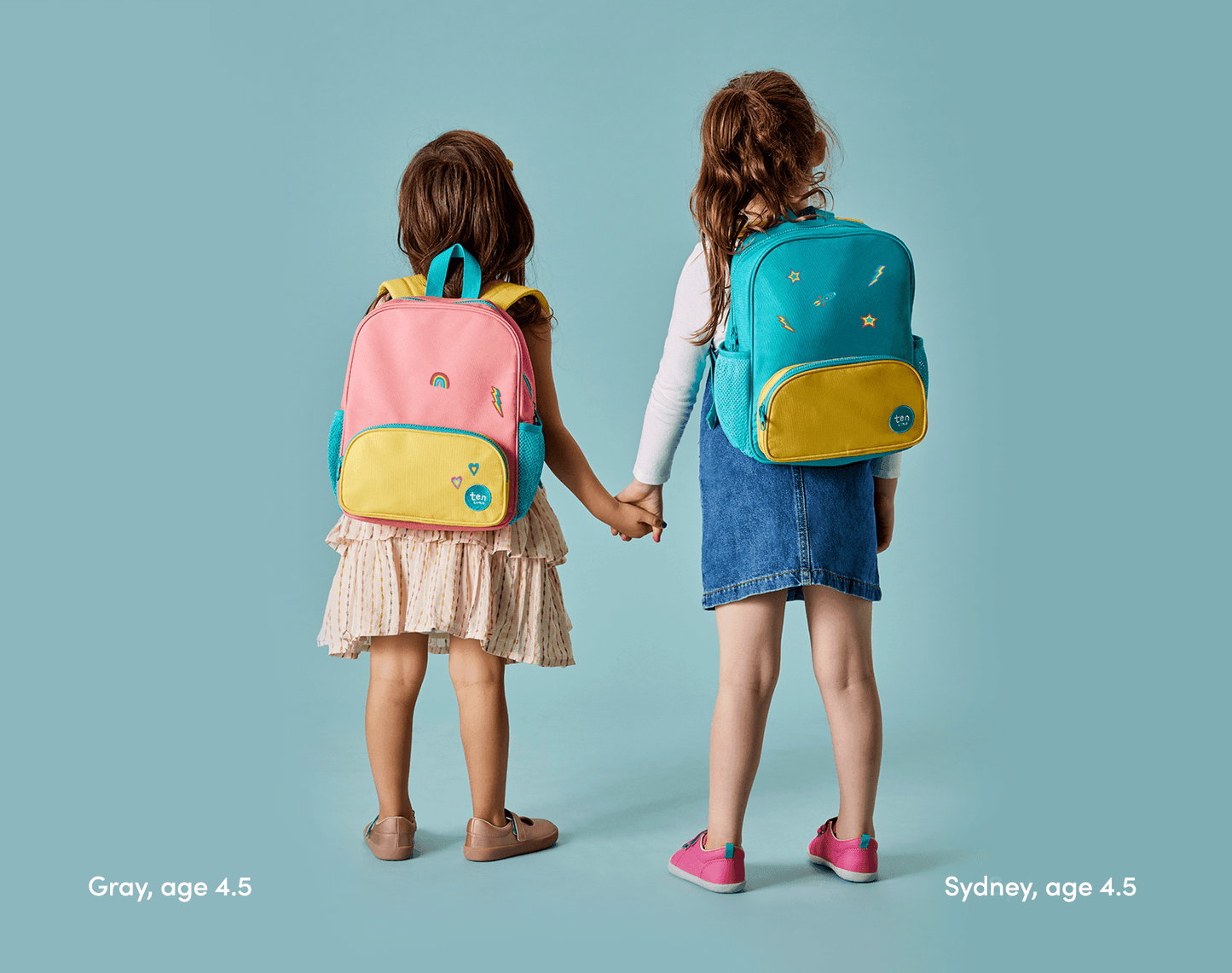Two girls age 4.5 wearing Ten Little Recycled Backpack 12 Inch - Assorted Colors. Available at www.tenlittle.com