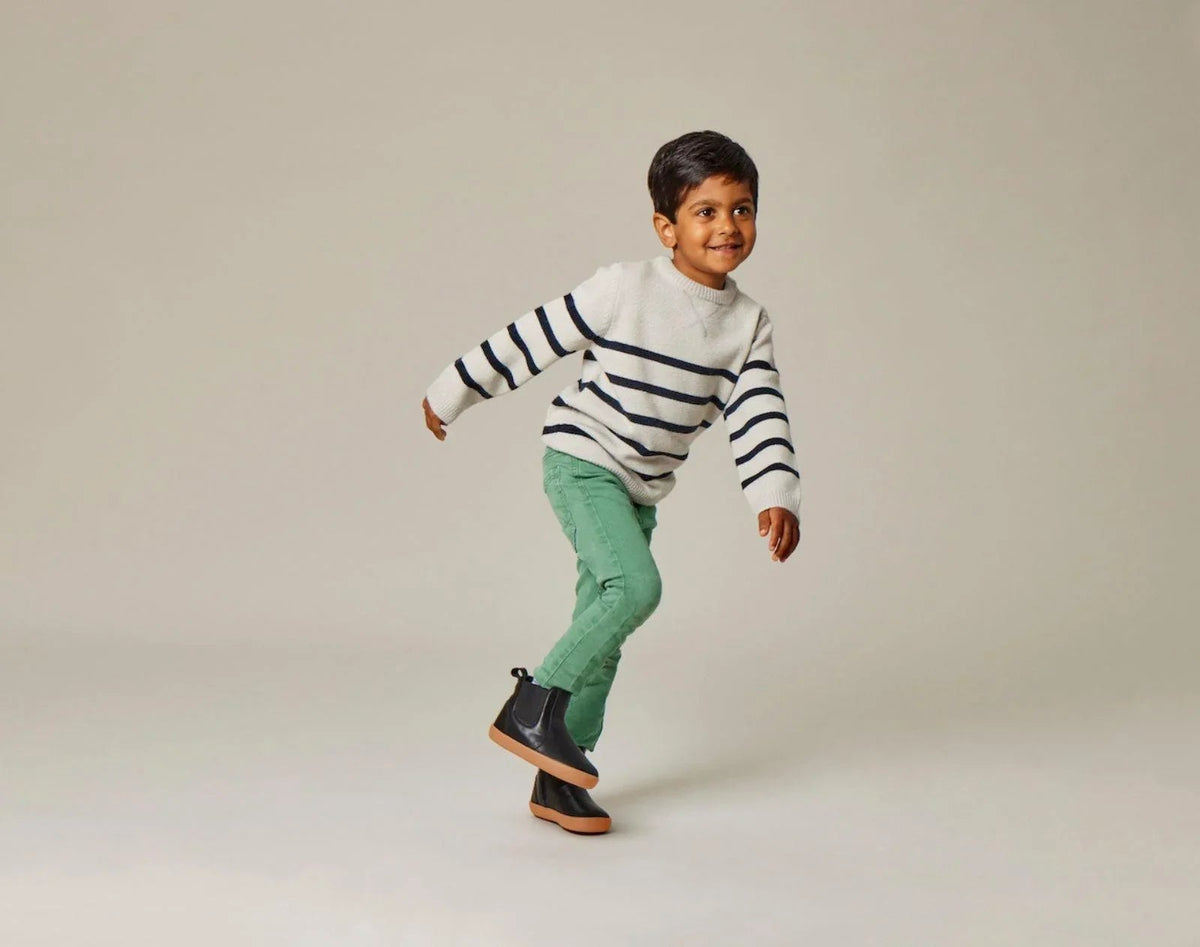 Child wearing Ten Little Chelsea Boots - Classic Black. Available at www.tenlittle.com