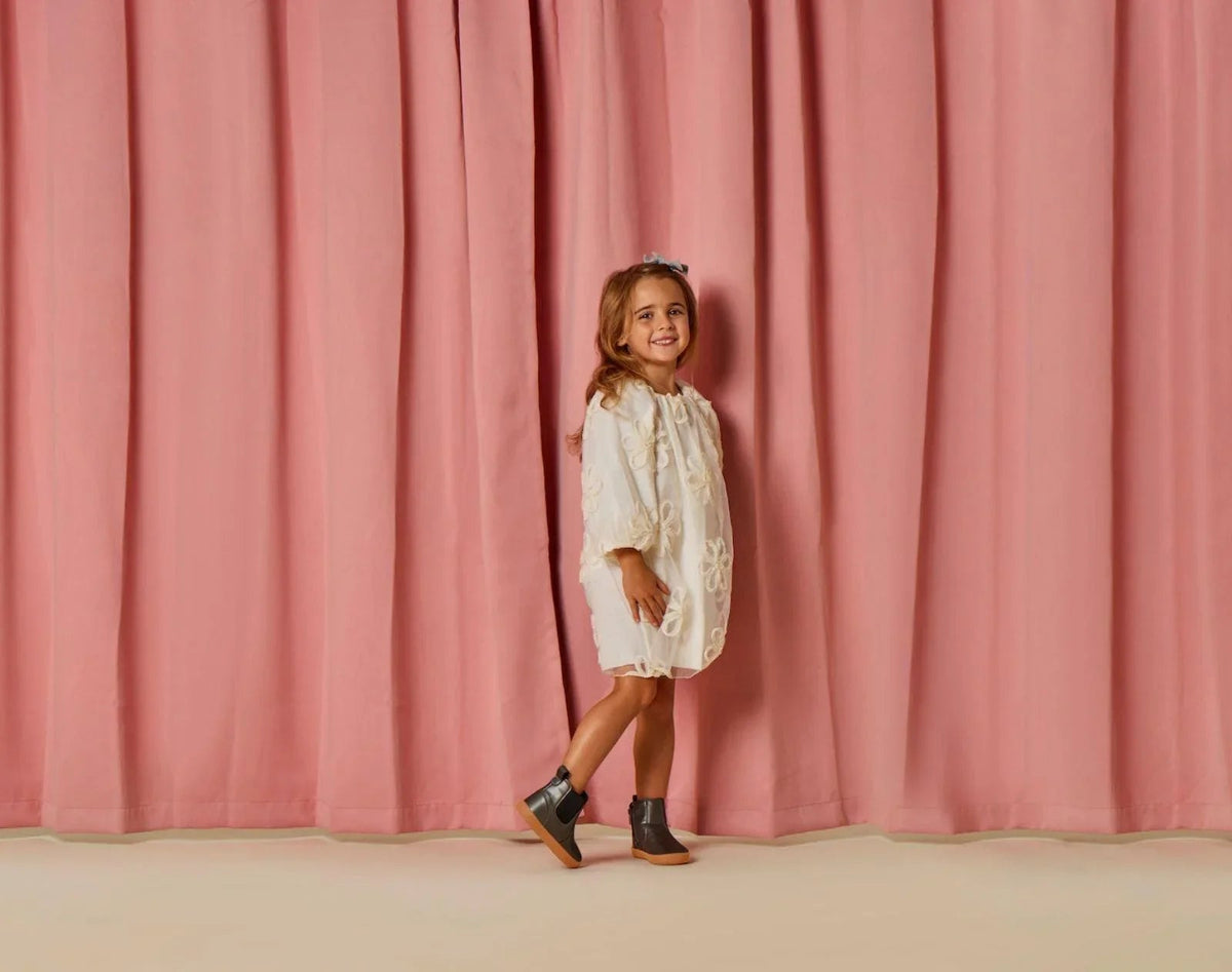Girl wearing Ten Little Chelsea Boots - Metallic Gray. Available at www.tenlittle.com