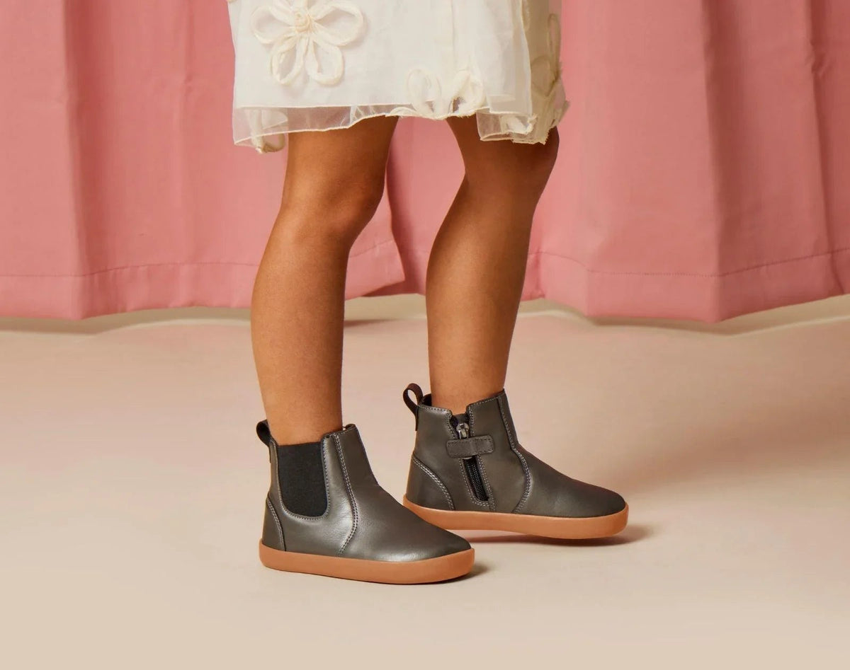 Side view child wearing Ten Little Chelsea Boots - Metallic Gray. Available at www.tenlittle.com