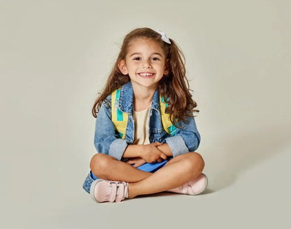 Child sitting wearing Ten Little Everyday Original - Blush Pink. Available at www.tenlittle.com