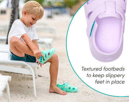 Split view of textured footbed and child putting on Ten Little Splash Sandals - Aqua Mint and Lavender Purple. Available at www.tenlittle.com