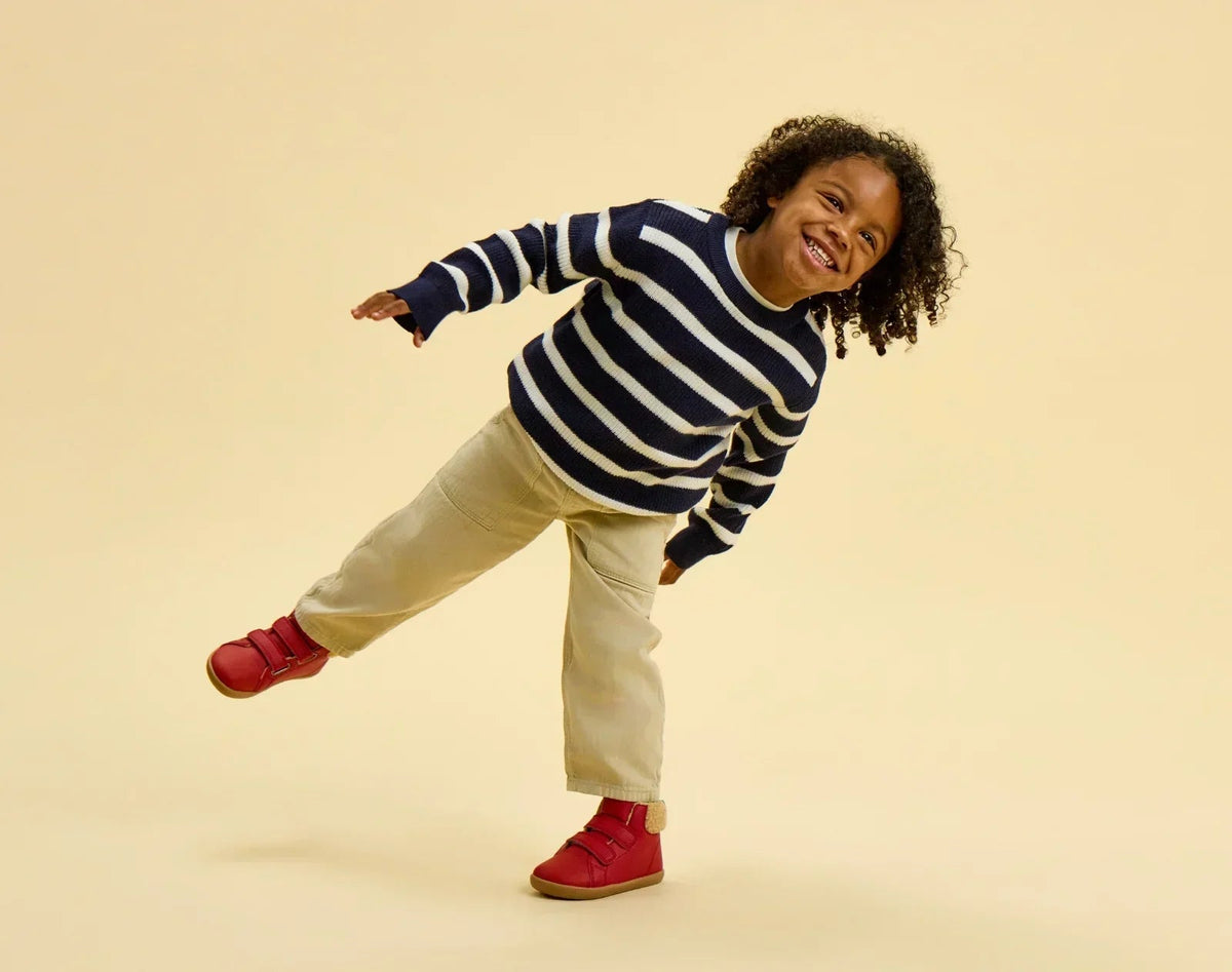 Child wearing Ten Little Furry High Tops - Lava Red. Available at www.tenlittle.com