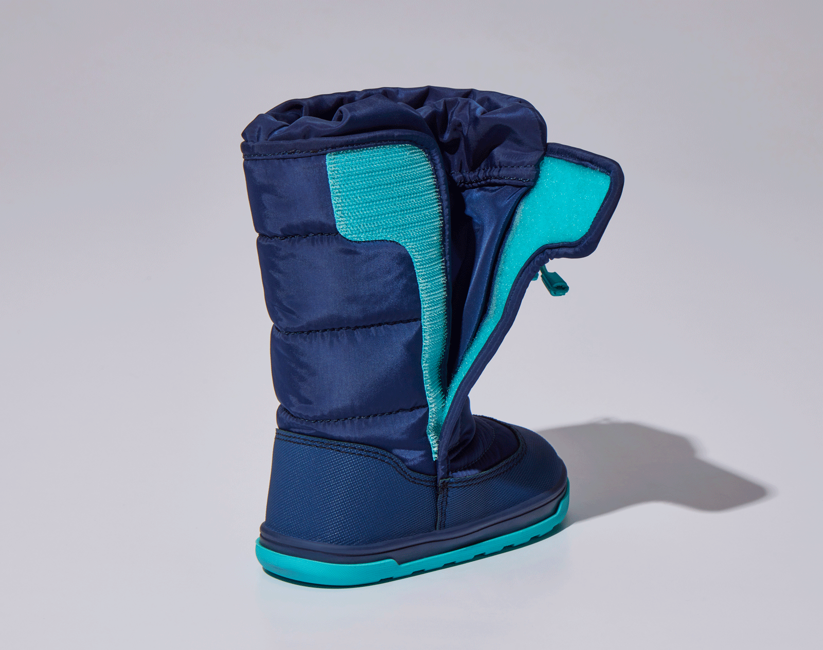 GIF of velcro closure and adjustable toggle on Ten Little Snow Boots - Navy Blue. Available at www.tenlittle.com